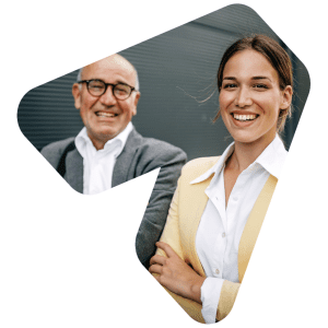 A father and daughter, both in corporate attire, smile brightly into the camera